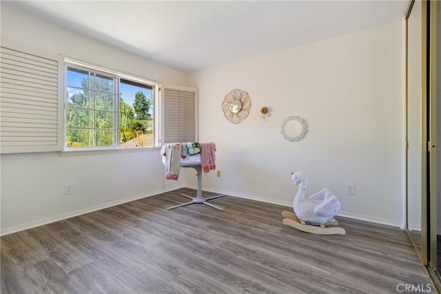 spare room with dark hardwood / wood-style floors