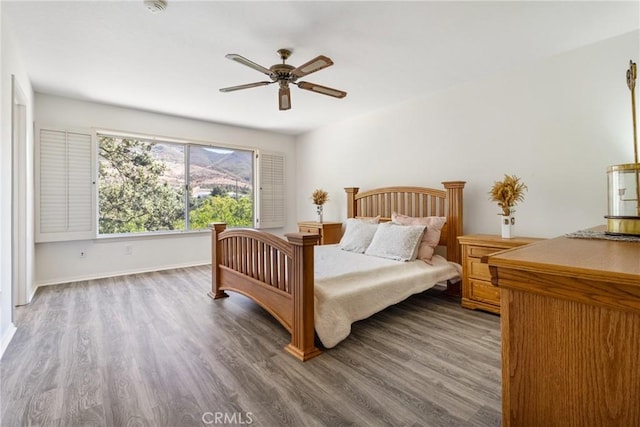 bedroom with wood-type flooring and ceiling fan