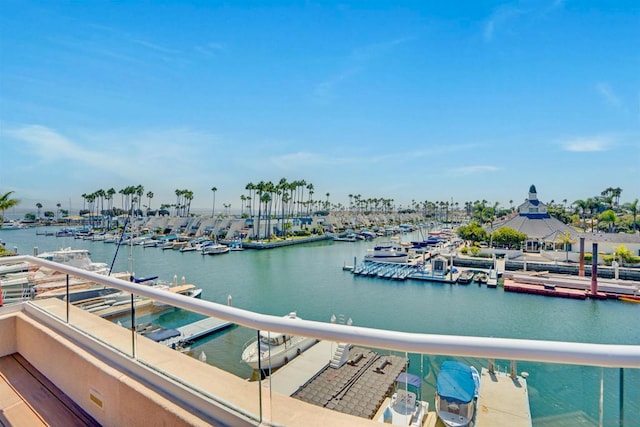 view of dock featuring a water view and a balcony