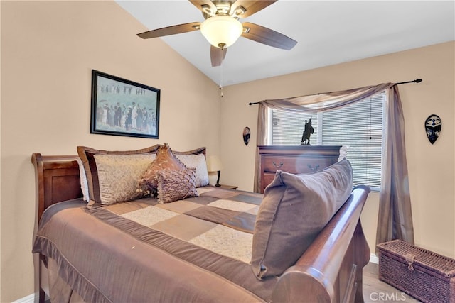 bedroom with light wood-type flooring, vaulted ceiling, and ceiling fan