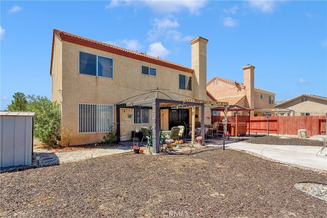 back of house featuring a patio