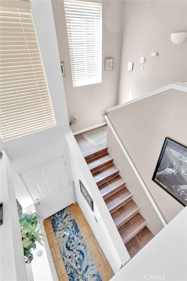 staircase featuring tile patterned floors