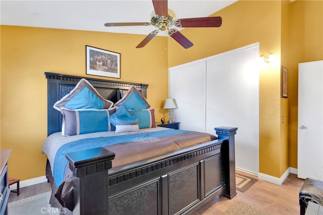 bedroom featuring lofted ceiling, ceiling fan, and light hardwood / wood-style floors