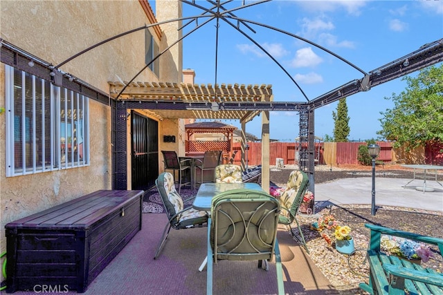 view of patio featuring a pergola