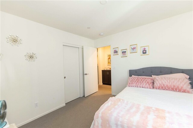 carpeted bedroom featuring a closet