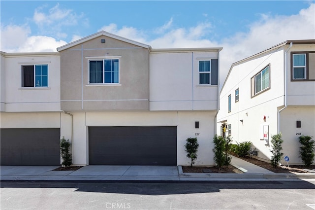 multi unit property featuring a garage