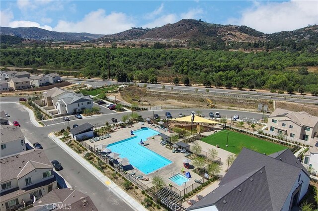 birds eye view of property with a mountain view