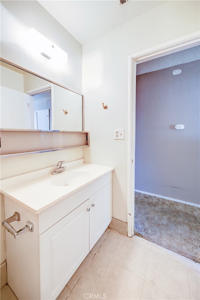 bathroom featuring vanity and tile patterned flooring