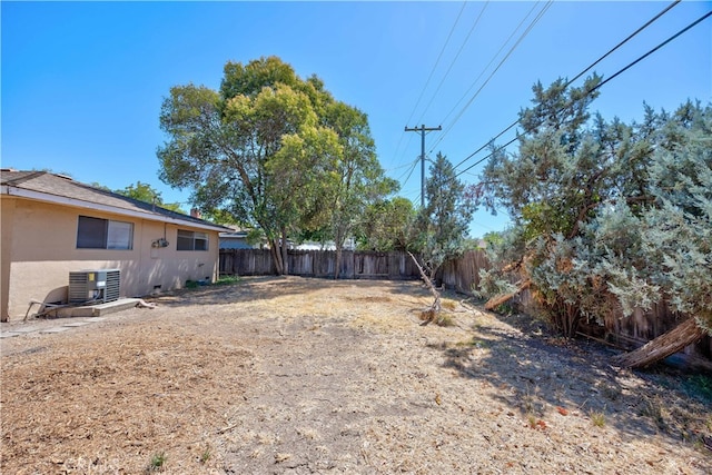 view of yard with central AC