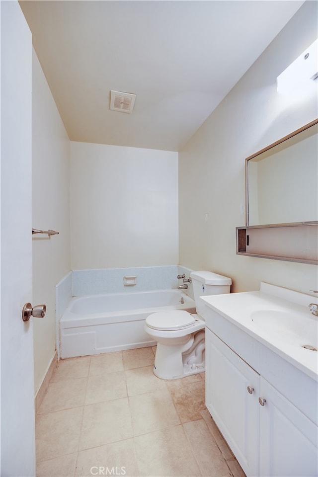 bathroom featuring vanity, toilet, a washtub, and tile patterned flooring