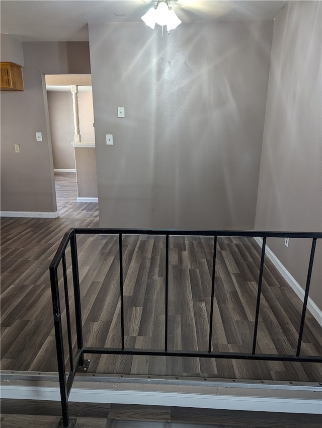 stairs featuring hardwood / wood-style floors and ceiling fan