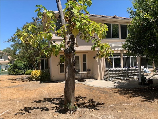 back of house featuring a patio