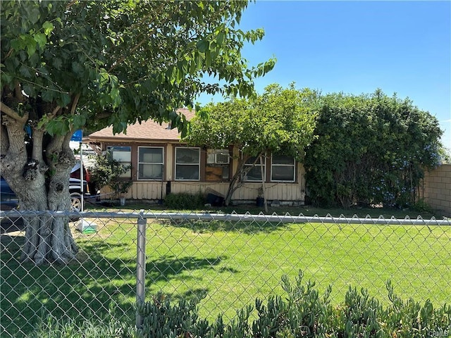 761 S Sycamore Ave, Rialto, CA 92376 - view of front of house with a front lawn