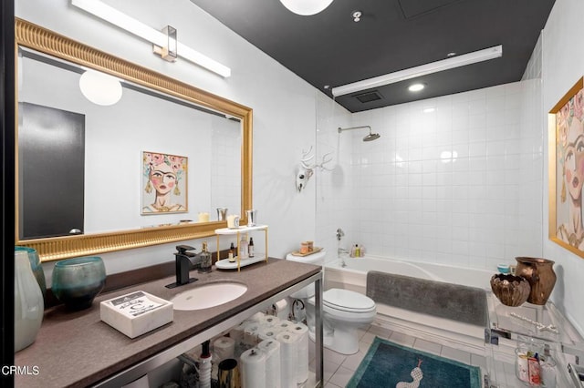 full bathroom featuring sink, toilet, tile patterned floors, and tiled shower / bath combo