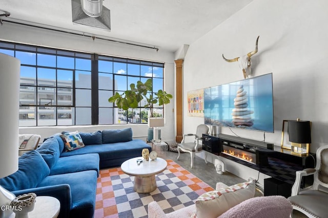 living room featuring concrete flooring