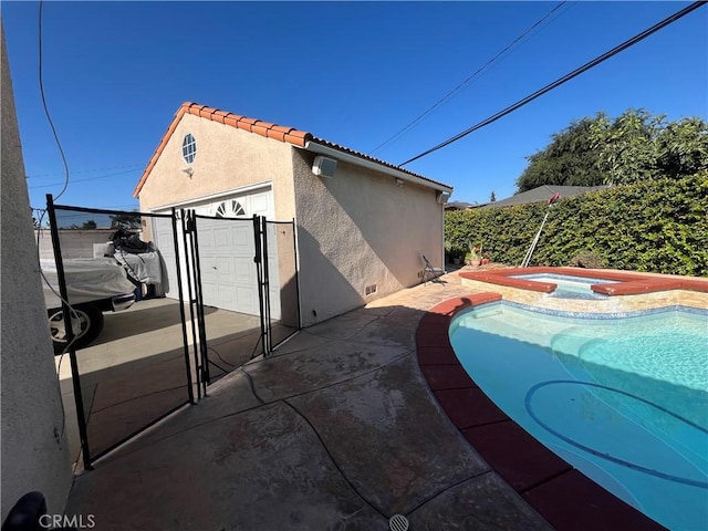 exterior space with a pool with hot tub and a patio