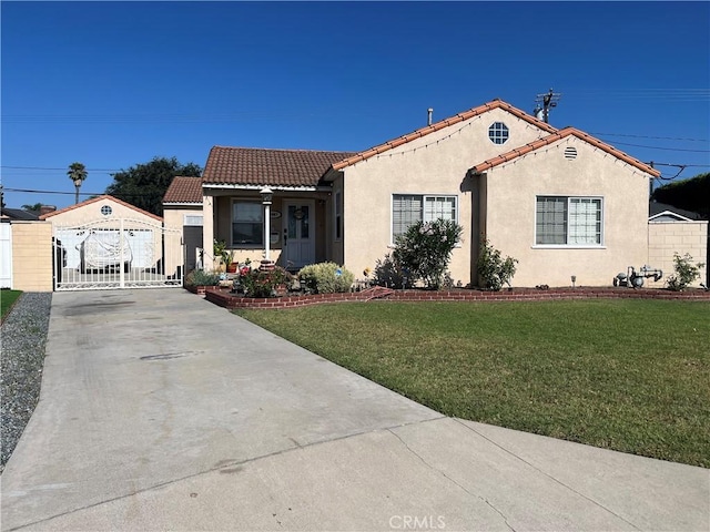 mediterranean / spanish-style house featuring a front yard