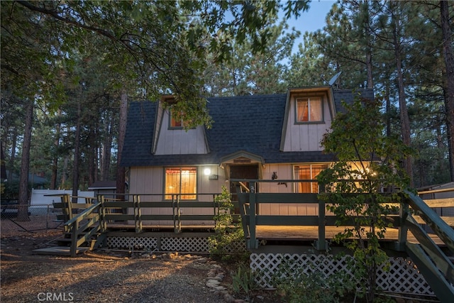 view of front of property featuring a wooden deck