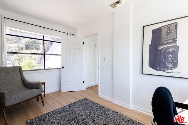 sitting room with light hardwood / wood-style floors