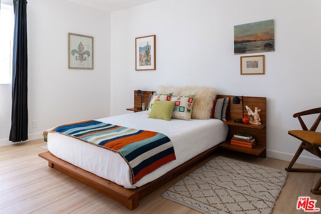 bedroom featuring light wood-type flooring