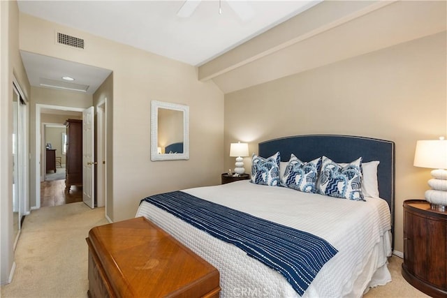 carpeted bedroom featuring ceiling fan, vaulted ceiling with beams, and a closet