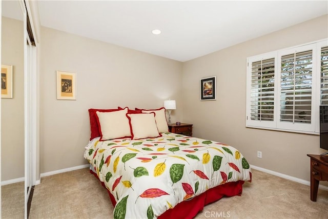 bedroom with light carpet