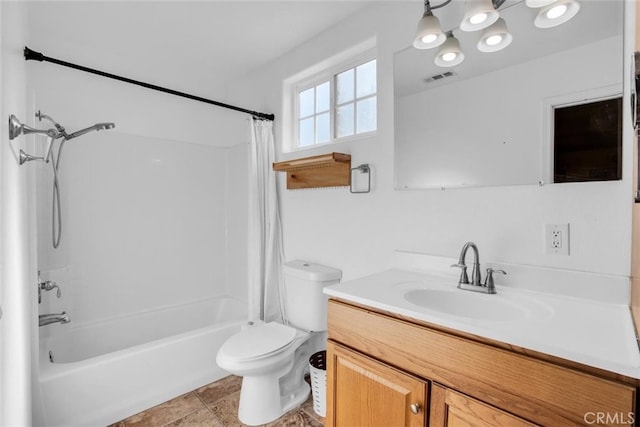 full bathroom with tile patterned flooring, a notable chandelier, shower / tub combo with curtain, vanity, and toilet