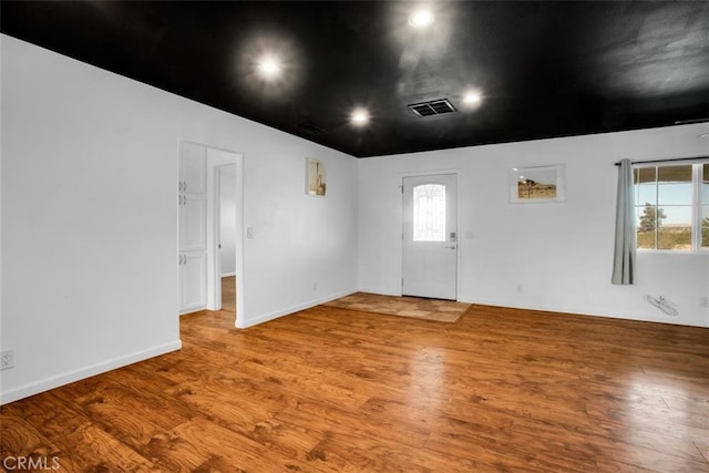 unfurnished room featuring hardwood / wood-style floors