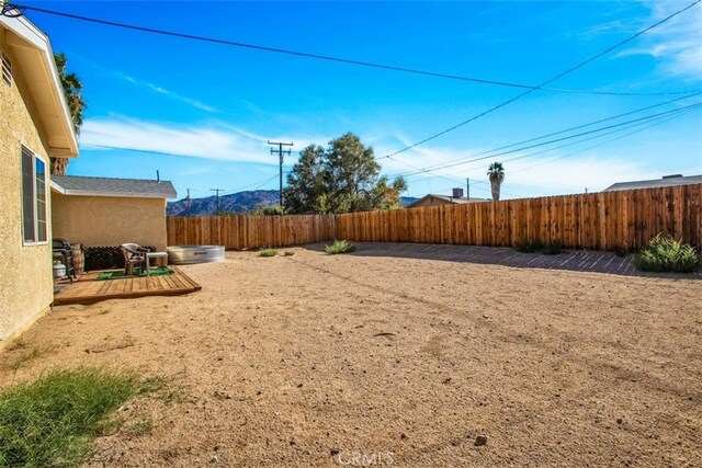 view of yard with a deck