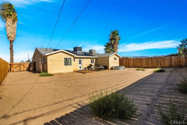 back of house with a patio area