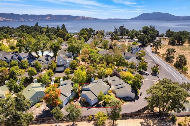 bird's eye view featuring a water and mountain view