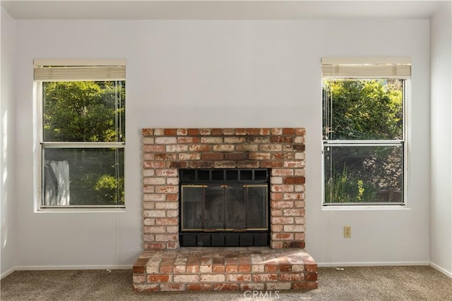 details with carpet flooring and a brick fireplace