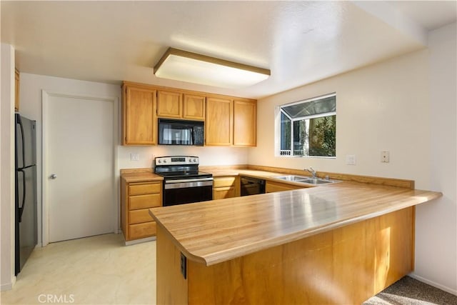 kitchen with light carpet, black appliances, kitchen peninsula, sink, and butcher block counters