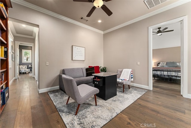 dining area featuring ornamental molding, dark hardwood / wood-style floors, and ceiling fan