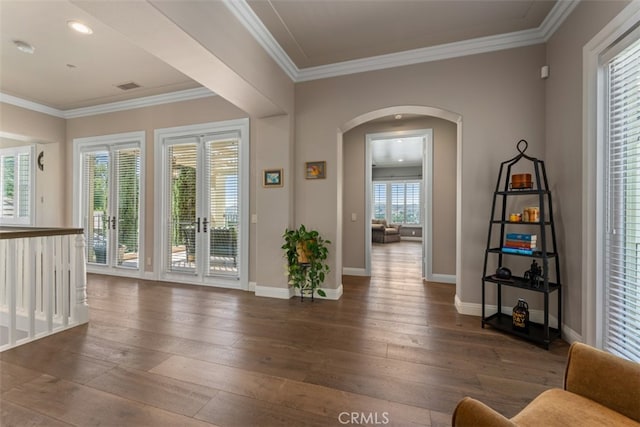 entrance foyer featuring crown molding, french doors, and dark hardwood / wood-style flooring