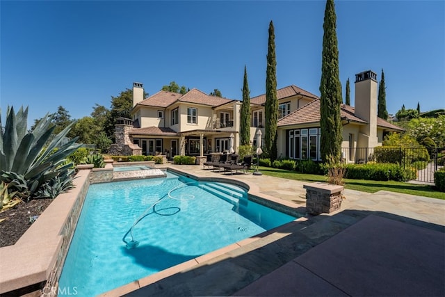 view of pool featuring a patio