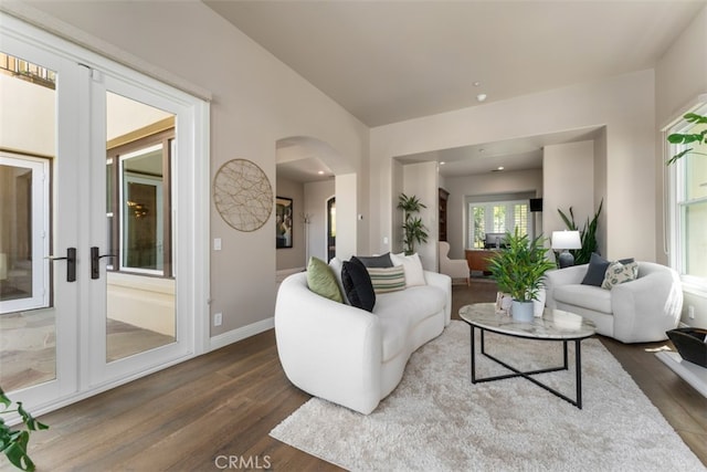 living room featuring french doors and dark hardwood / wood-style floors