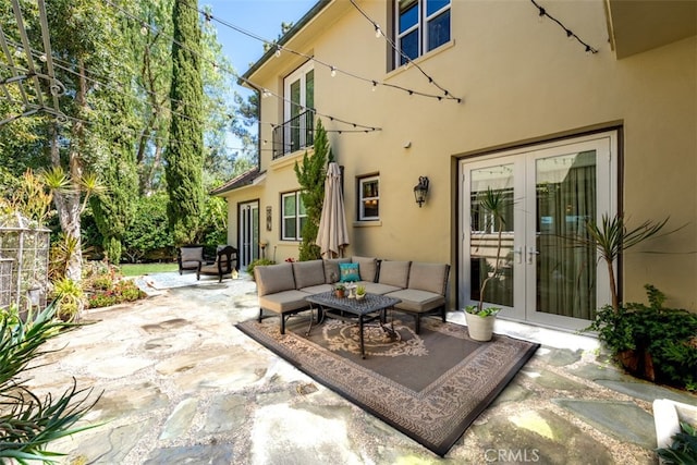 view of patio / terrace featuring french doors and an outdoor living space