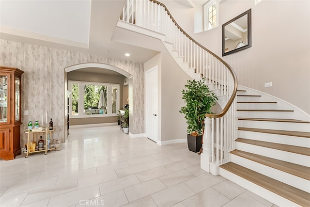 foyer entrance with light tile patterned floors