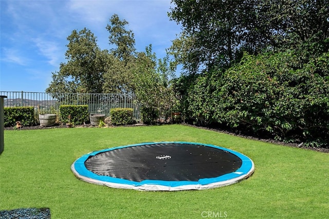 view of yard with a trampoline