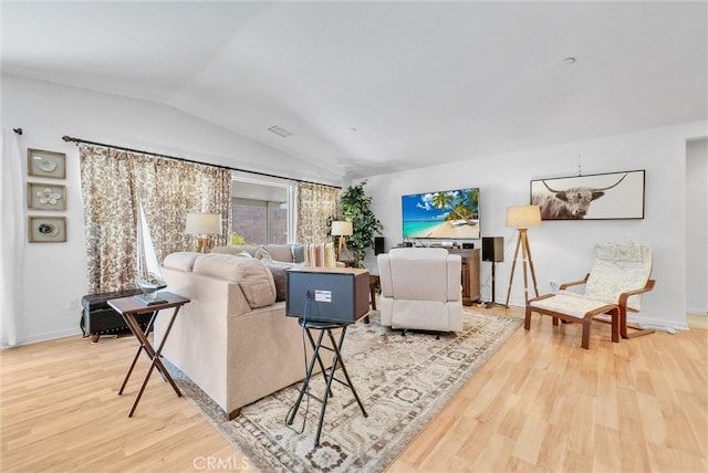 living room with wood-type flooring and lofted ceiling