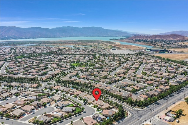 birds eye view of property with a mountain view