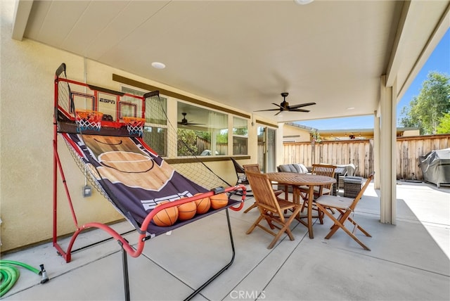 view of patio / terrace featuring ceiling fan and grilling area