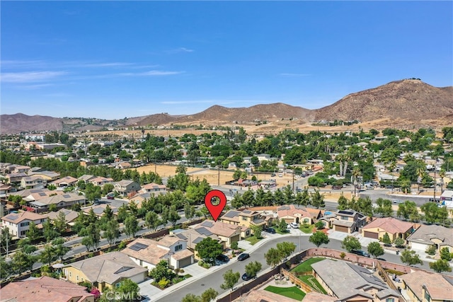 birds eye view of property featuring a mountain view