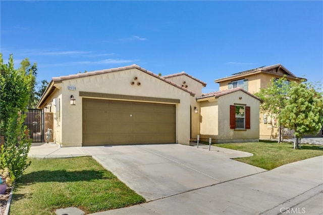 view of front of house with a front lawn and a garage