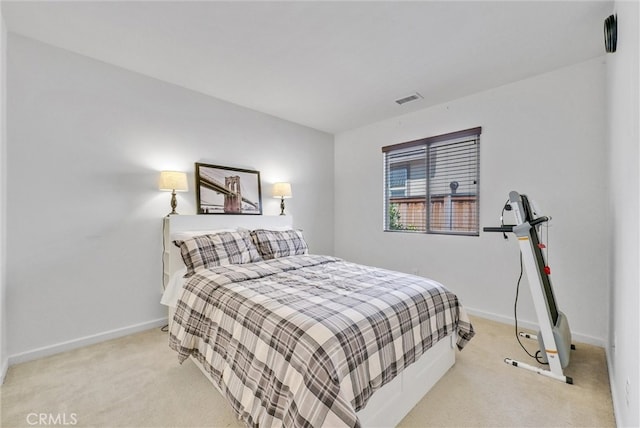 bedroom with light carpet