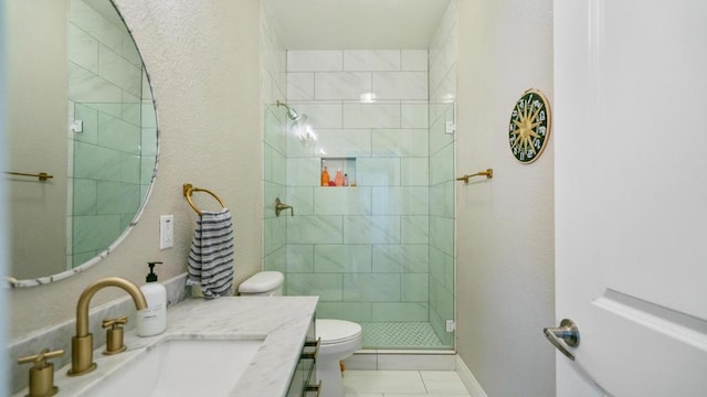 bathroom with toilet, tile patterned floors, a shower with shower door, and vanity