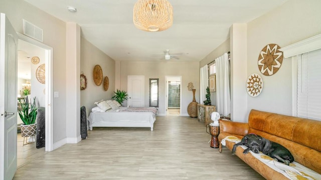 bedroom featuring ceiling fan and light hardwood / wood-style flooring