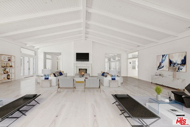 living room featuring beam ceiling, high vaulted ceiling, and wood-type flooring