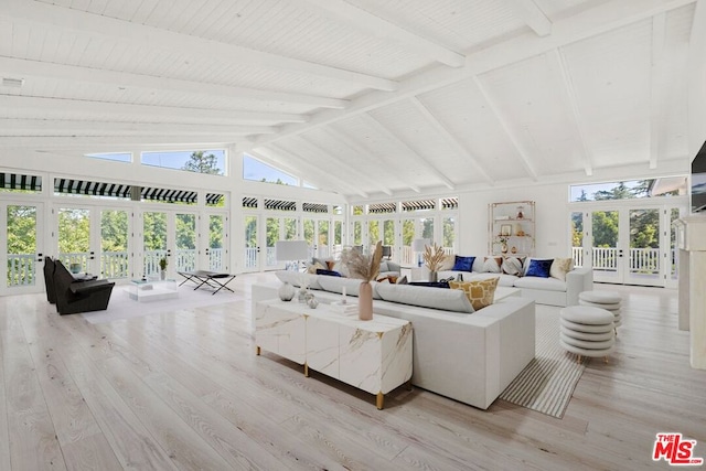 sunroom featuring french doors, lofted ceiling with beams, and plenty of natural light